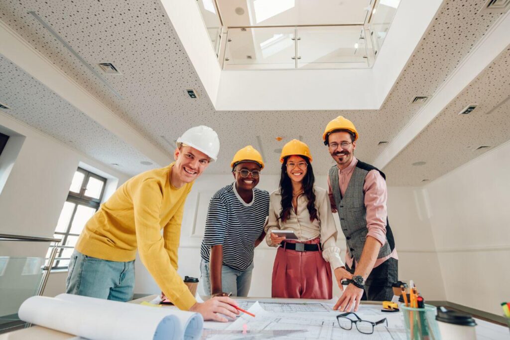 Group of architects gathering at table.