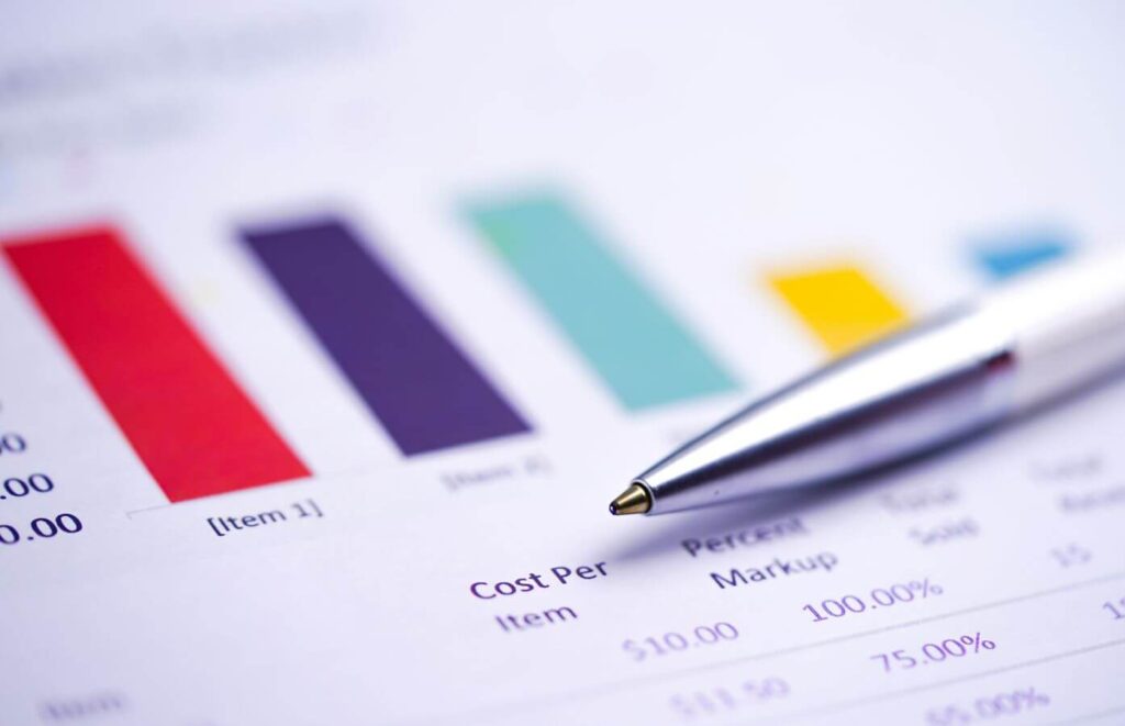 A pen on a financial report spreadsheet.